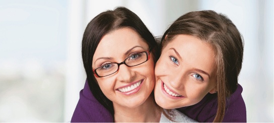 A daughter hugging her mother